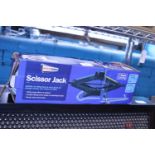 A boxed scissor jack