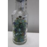 A vintage bottle with marbles