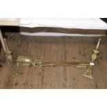 A pair of antique brass fire dogs and fireside items. Postage unavailable