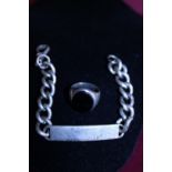 A hallmarked silver ID bracelet and silver and Onyx ring