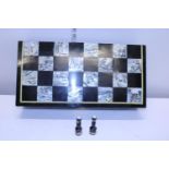 A MOP inlaid chess set and board