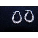 A pair of 9ct gold earrings 0.60g