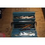 A metal tool box and contents