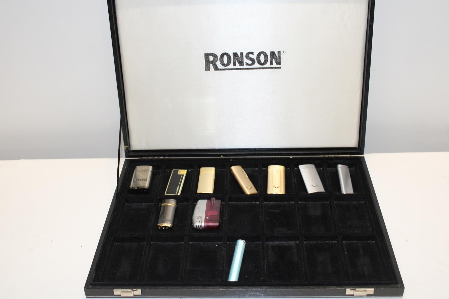 A Ronson lighter case and contents of lighters