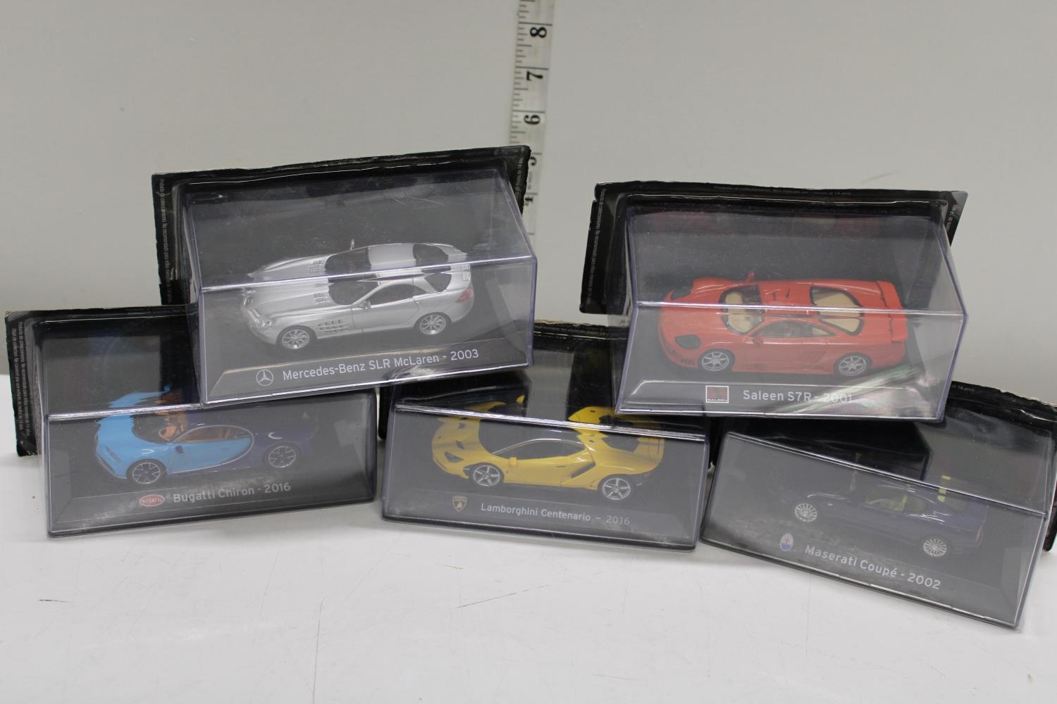 Five boxed die-cast car models