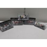 Five boxed die-cast Formula One models