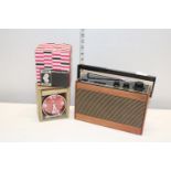 A vintage portable radio and a Smiths 30 hour alarm clock