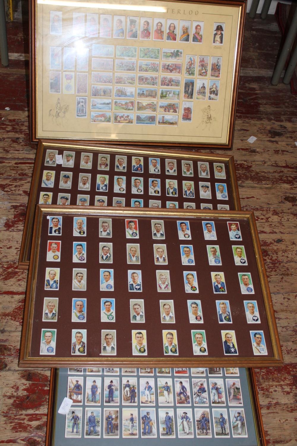 A selection of framed cigarette card collections