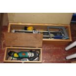 A manual tile cutter and electric angle grinder