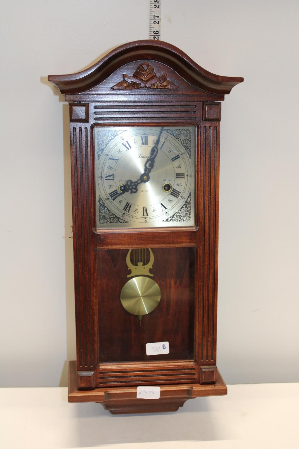 A vintage Lincoln 31 day wall clock, postage unavailable