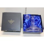 A boxed Rockingham crystal ships decanter