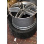A DB9 Aston Martin 9 1/2 in wheel & Tyre, postage unavailable