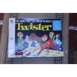 A boxed vintage Twister game (unused)