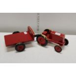 A vintage child's wooden tractor and cart