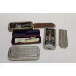 Three vintage Rolls Razors and one other