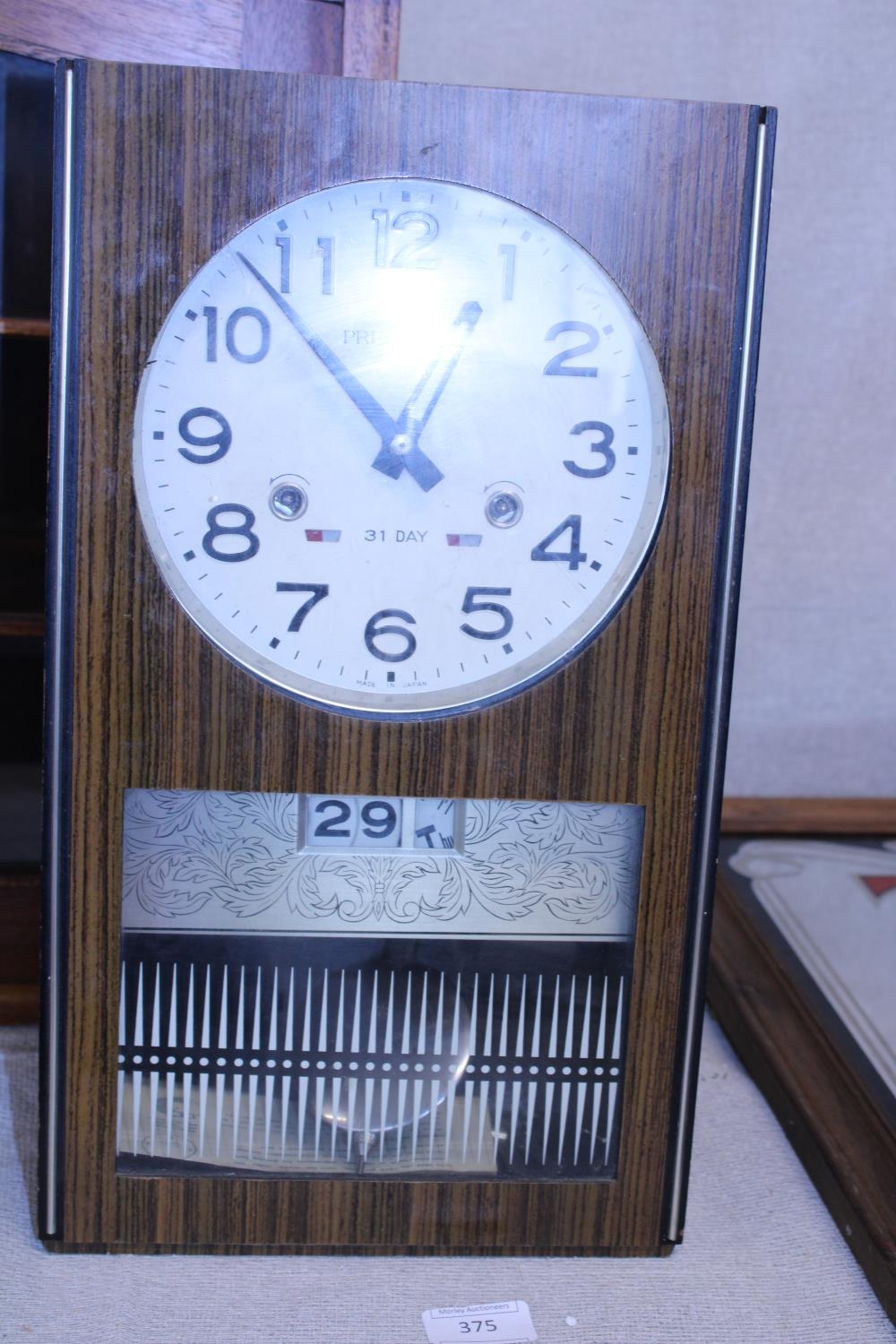 A vintage President 31 day wall clock