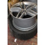A DB9 Aston Martin 12in wheel & Tyre, postage unavailable