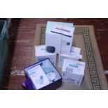 A selection of boxed electrical breast pumps and a tens machine