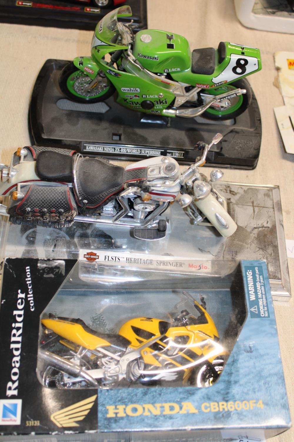 Three assorted die-cast motorbike models