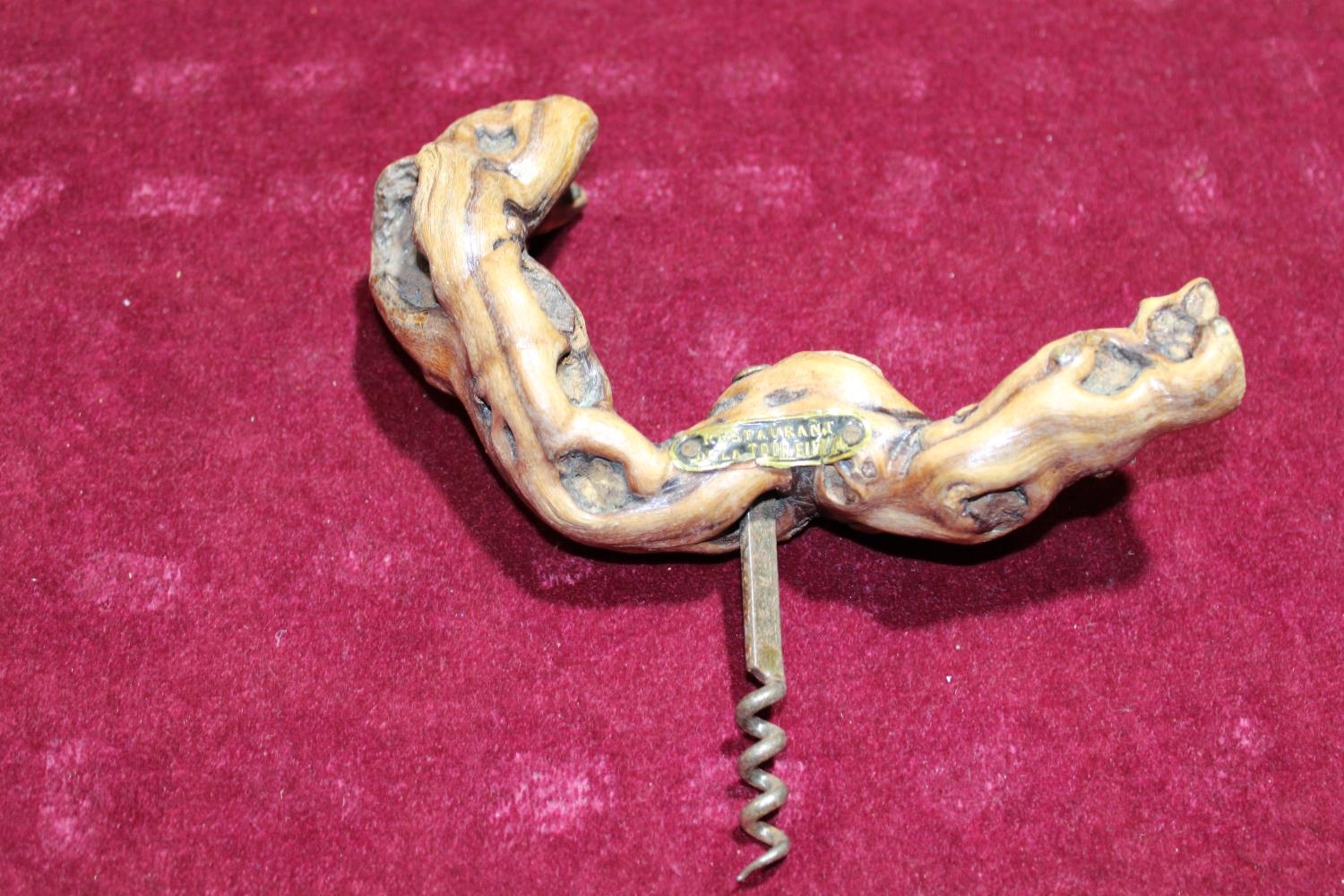 A petrified wooden handled corkscrew