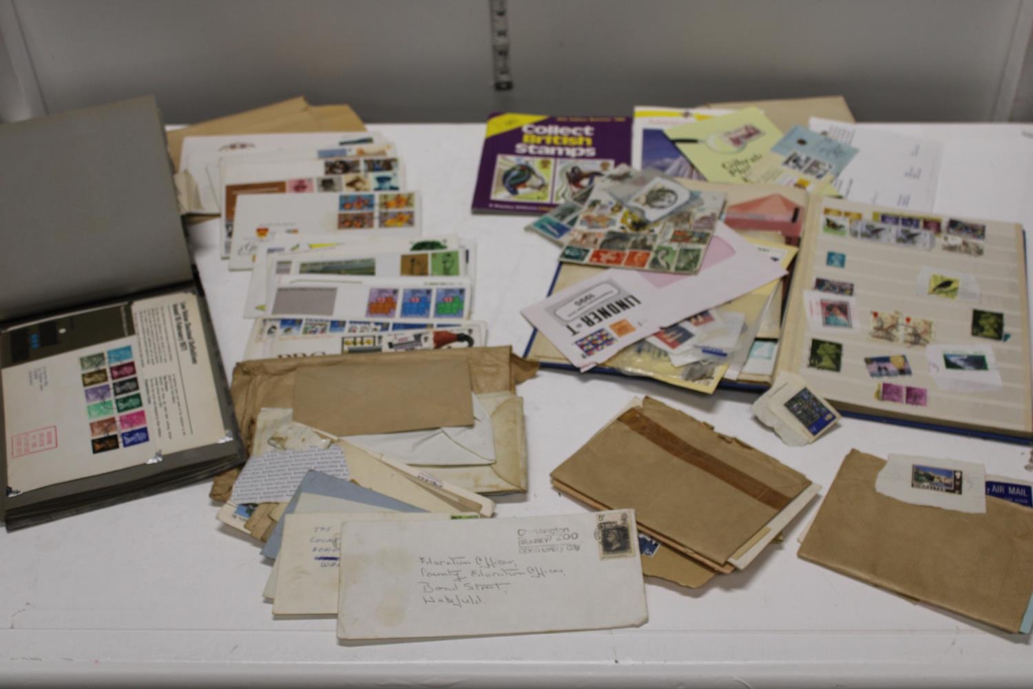 A job lot of first day covers and stamp albums