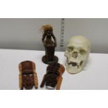 A selection of collectable items including ceramic skull