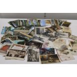 A job lot of assorted antique and vintage postcards