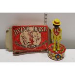 A vintage boxed jiving jigger mechanical toy