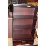 A mahogany bookcase with under drawer. collection only