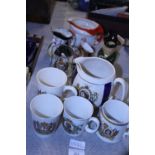 A large selection of commemorative ware and toby jugs