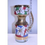 A hand decorated glass jug