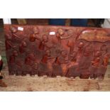 A hand carved wooden freeze from Nigeria, postage unavailable