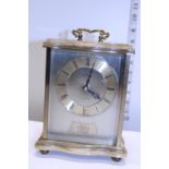 A Oynx and glass cased mantle clock