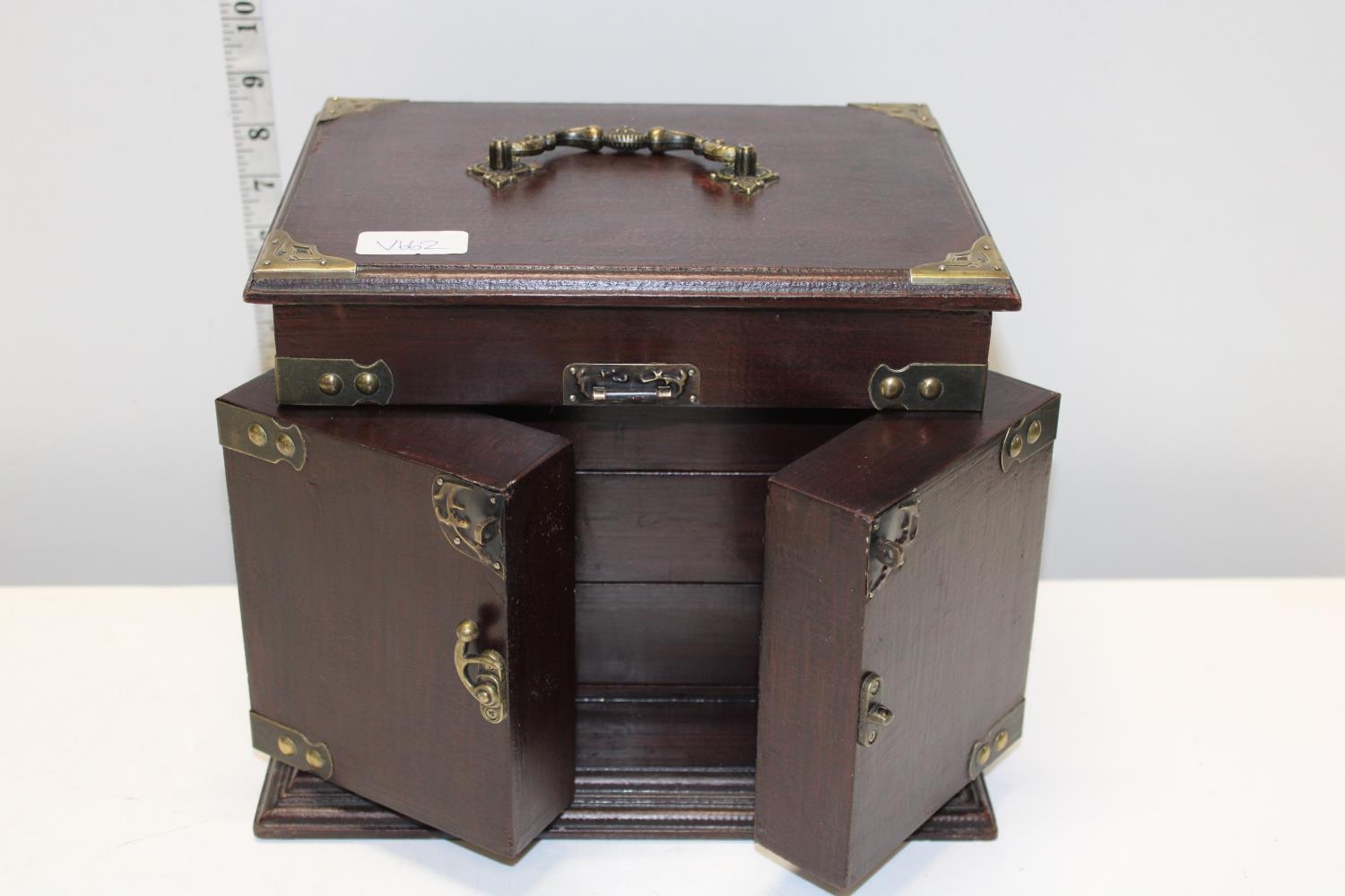 A Oriental wooden and brass jewellery cabinet