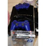 A Playstation 3 with controllers and games