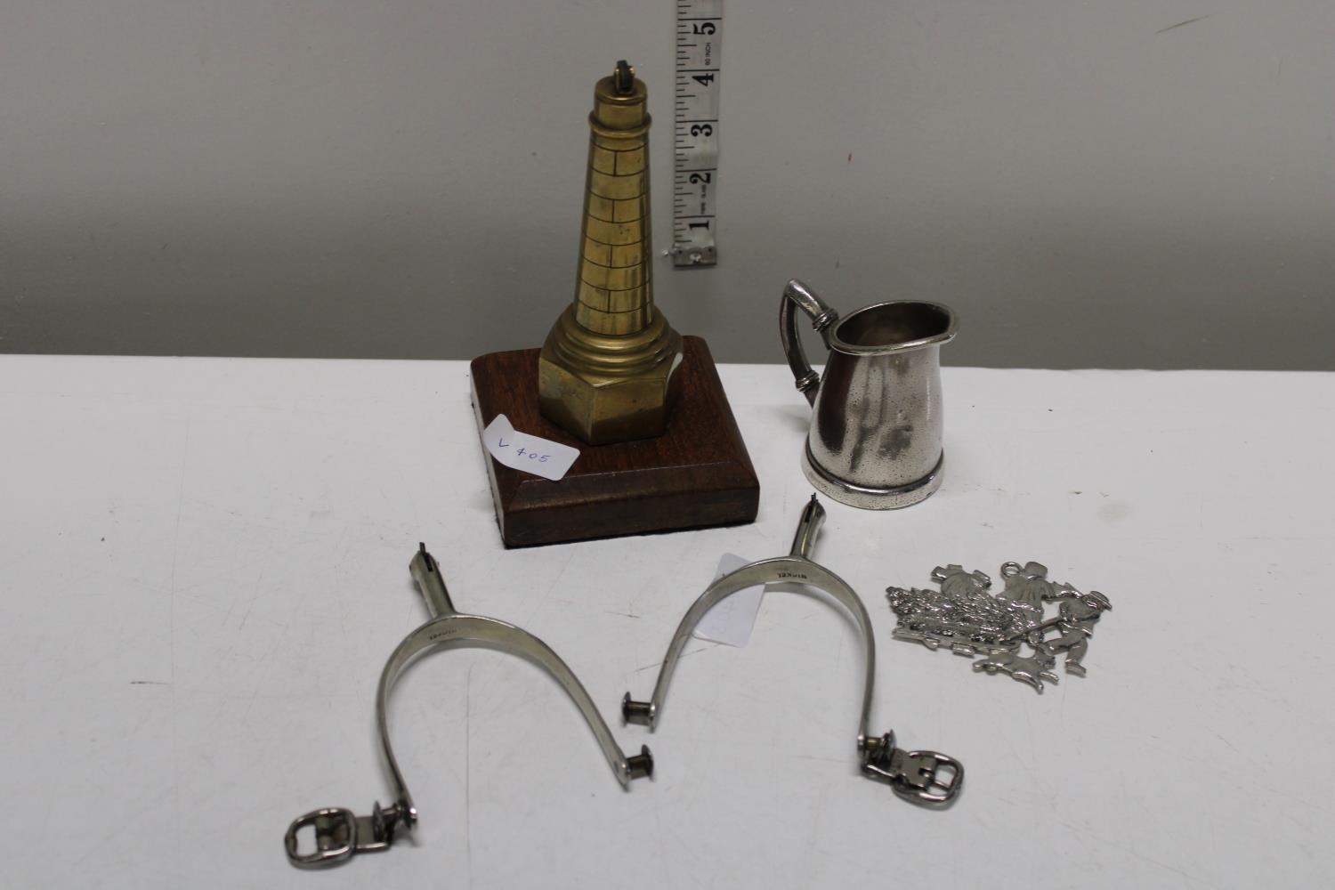 A job lot of assorted collectables including antique stirrups and novelty lighter