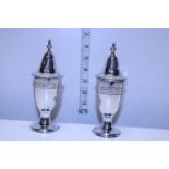 A pair of silver plated salt and pepper pots