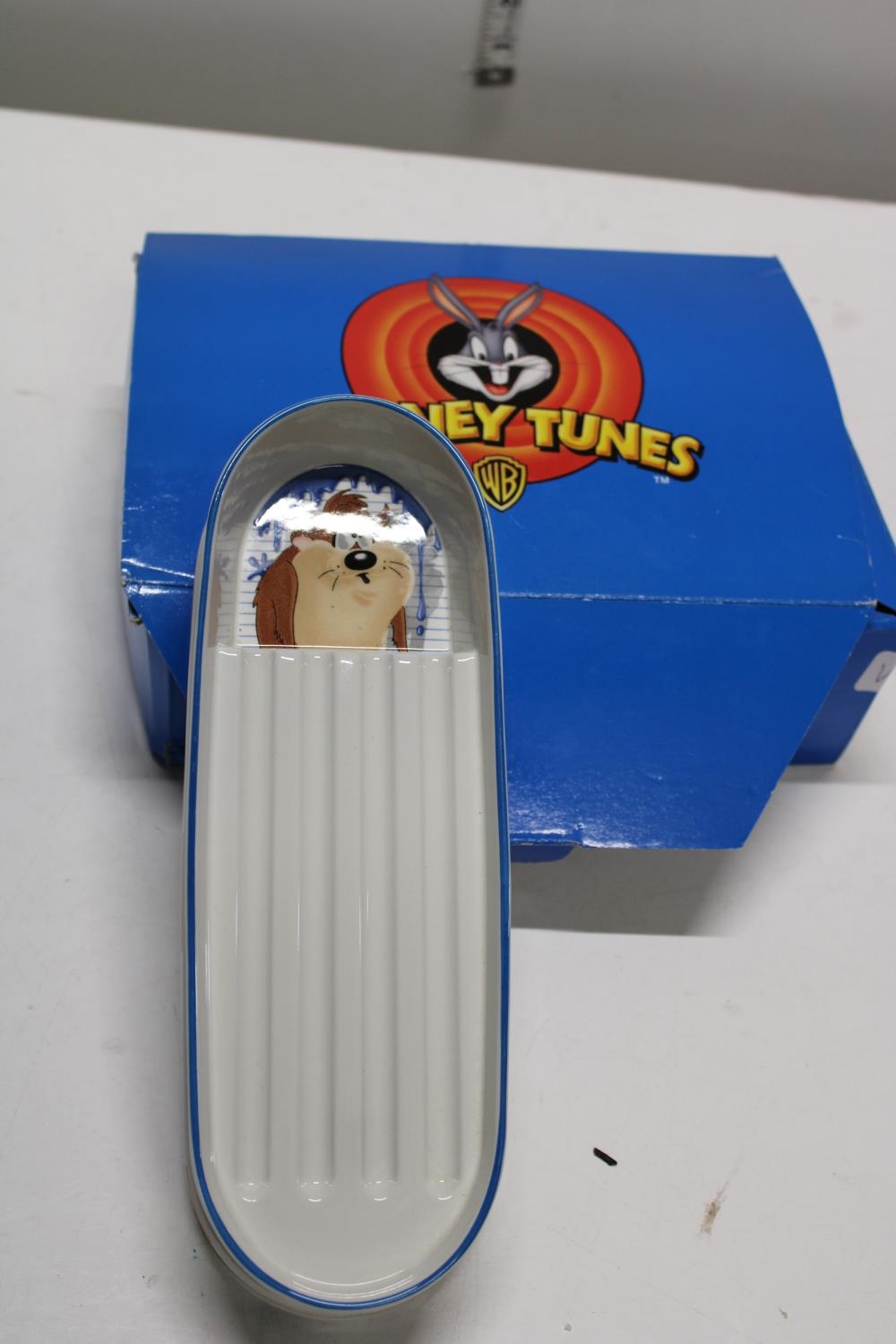 A boxed Looney Tunes Wedgewood pen tray