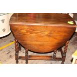 A oak drop leaf table with bobbin turn legs. collection only