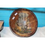 A hand carved African wooden bowl with hand painted decoration to interior