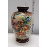 A vintage hand painted glass vase