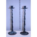 A pair of bronze candlesticks