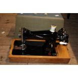 A vintage Pinnock sewing machine, postage unavailable