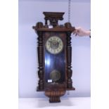 A antique Vienna style wall clock with key, postage unavailable