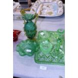 A selection of antique green glassware