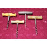 Four antique treen handled corkscrews