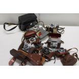 A job lot of assorted vintage cameras and accessories