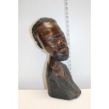 A large carved wooden African bust
