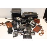 A job lot of assorted vintage cameras and accessories