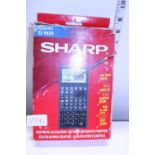 A boxed sharp scientific calculator